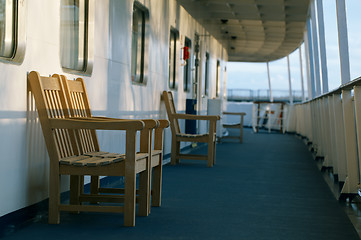 Image showing Wooden chairs on the deck of cruise liner