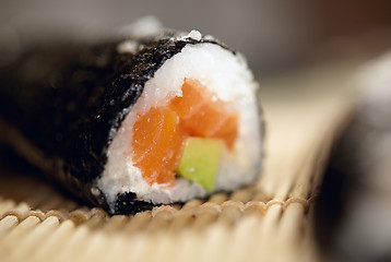 Image showing Susshi roll with salmon and avocado.