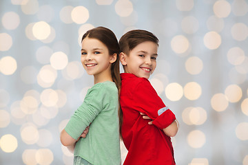 Image showing happy boy and girl standing together