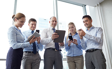 Image showing business people with tablet pc and smartphones