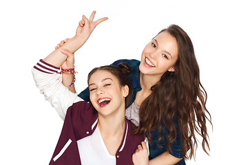 Image showing happy pretty teenage girls showing peace hand sign