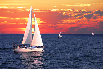 Image showing Sailboats at sunset