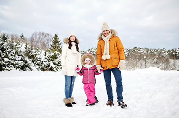 Image showing happy family with child in winter clothes outdoors