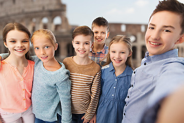 Image showing children talking selfie over coliseum in rome