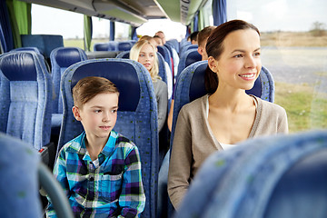 Image showing happy family riding in travel bus