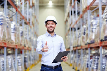 Image showing happy man at warehouse showing thumbs up gesture