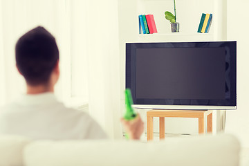 Image showing man watching tv and drinking beer at home