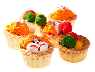 Image showing Cupcakes with smiley faces isolated on white.