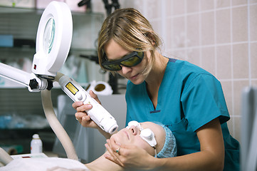 Image showing Woman undergoing laser skin treatment