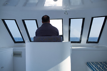 Image showing Man navigating a boat