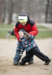 Image showing Two young brothers playing outdoors in winter