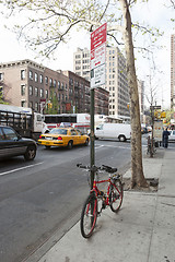 Image showing Bike tied to pole in New York