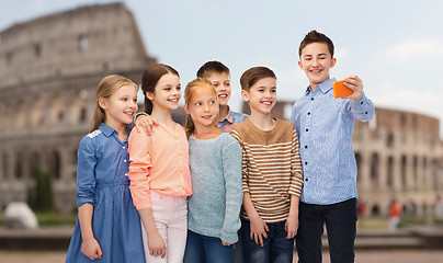 Image showing happy children talking selfie by smartphone