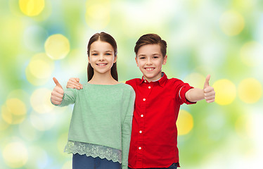 Image showing happy boy and girl showing thumbs up