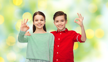 Image showing happy boy and girl showing ok hand sign