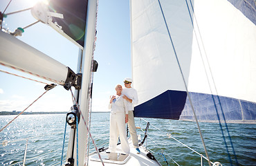 Image showing senior couple hugging on sail boat or yacht in sea