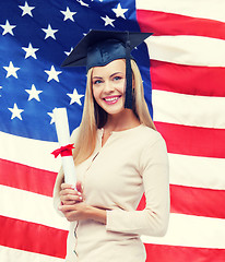 Image showing student in graduation cap with certificate