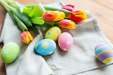 Image showing close up of colored easter eggs and flowers