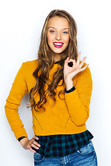 Image showing happy young woman or teen showing ok hand sign