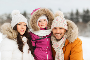 Image showing happy family with child in winter clothes outdoors