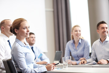 Image showing group of smiling businesspeople meeting in office