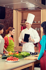 Image showing happy women with chef and tablet pc in kitchen