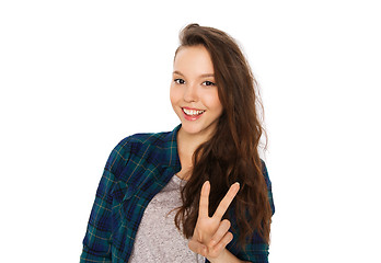 Image showing happy smiling teenage girl showing peace sign
