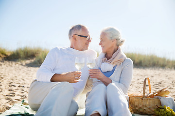 Image showing happy senior couple talking on summer beach