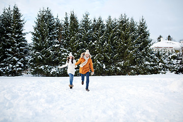 Image showing happy couple running in winter snow