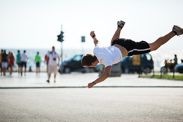 Image showing Urban acrobatics with somersault