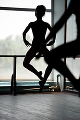 Image showing Two ballet dancers doing jumps