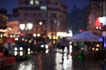 Image showing Blurred cityscape on a rainy evening