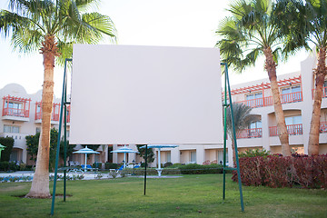 Image showing Blank billboard with tropical palm trees