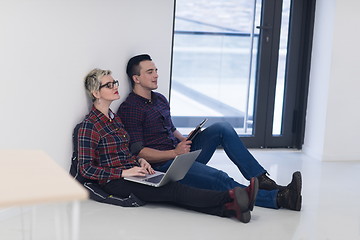 Image showing startup business, couple working on laptop computer at office