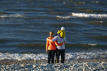 Image showing Young family enjoying a day at the seaside