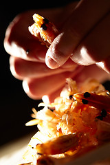 Image showing Shrimp in hands. Vertical shot.