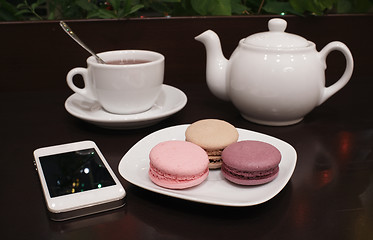 Image showing Tea and macaroons with a tablet computer