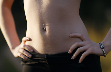 Image showing Girl belly with piercing