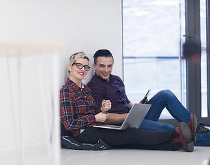 Image showing startup business, couple working on laptop computer at office