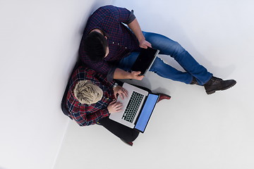 Image showing top view of  couple working on laptop computer at startup office