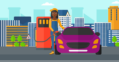 Image showing Woman filling up fuel into car.