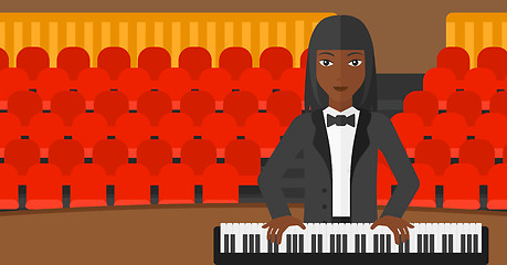 Image showing Woman playing piano.