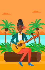 Image showing Woman playing guitar.