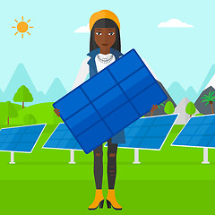 Image showing Woman holding solar panel.