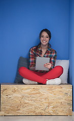 Image showing woman in crative box working on tablet