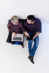 Image showing top view of  couple working on laptop computer at startup office