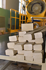 Image showing Pieces of soap on a conveyor belt