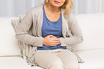 Image showing close up of woman suffering from stomach ache