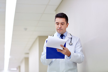 Image showing doctor with clipboard at hospital corridor