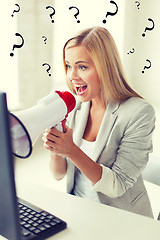 Image showing crazy businesswoman shouting in megaphone